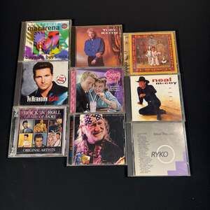 Lot of 9 Assorted Music CDs Including Willie Nelson, Toby Keith, and Mellencamp
